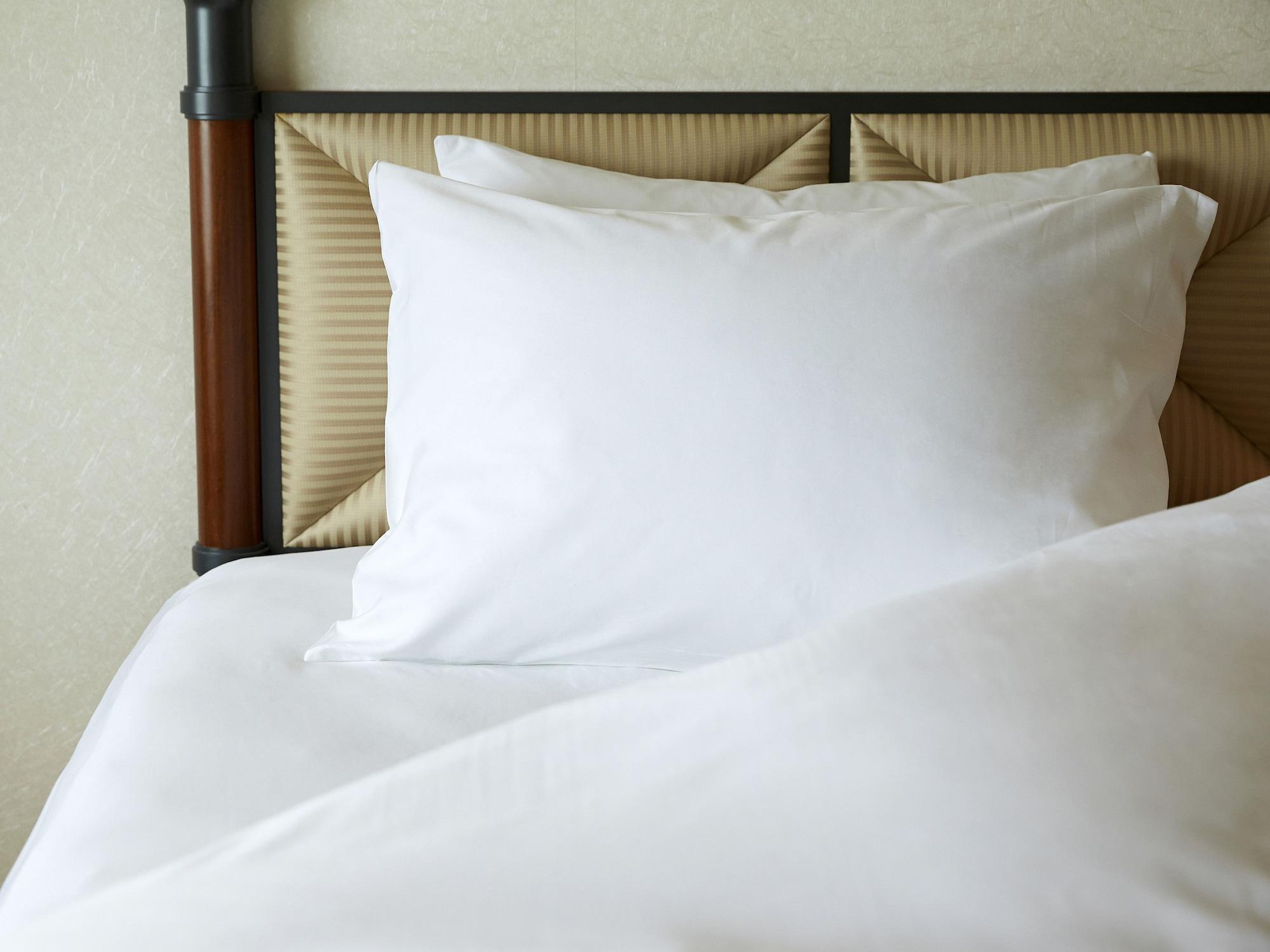 Miyako Hotel Gifu Nagaragawa Exterior photo A pillow on a bed